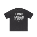 Black t-shirt with white text 'I speak sarcasm fluently' on a white background