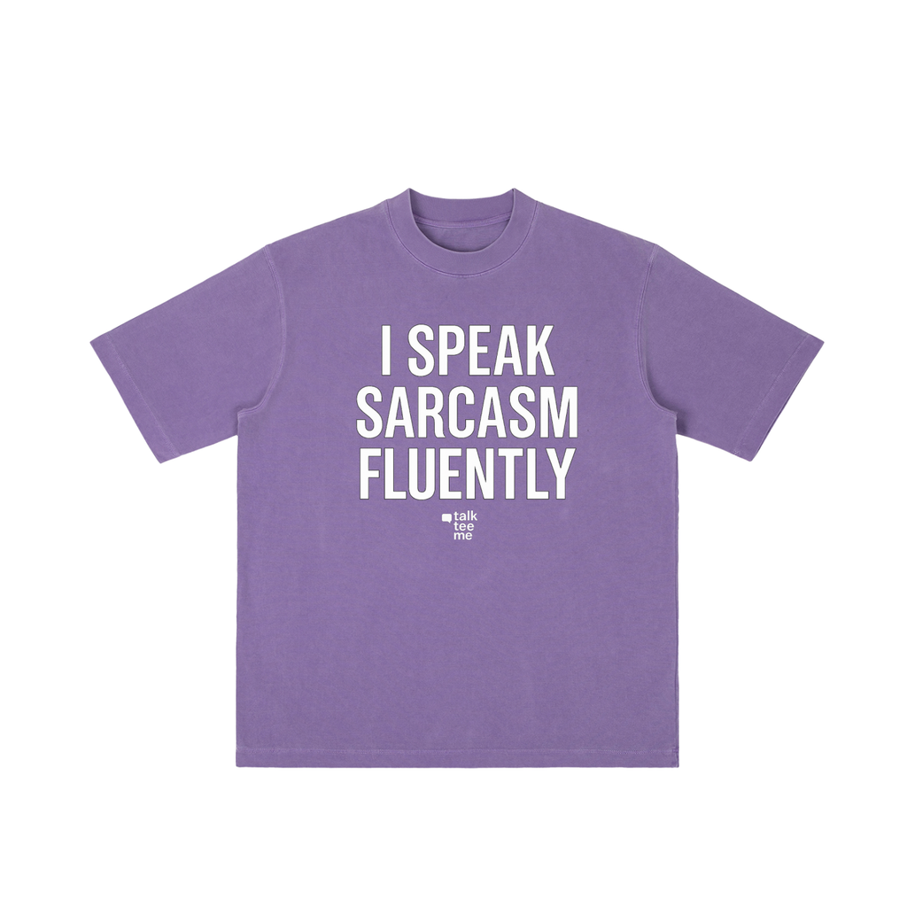 Purple t-shirt with white text 'I Speak Sarcasm Fluently' on a white background